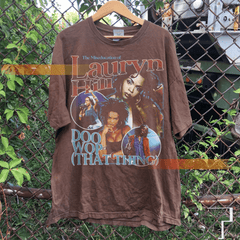 a t - shirt hanging on a chain link fence