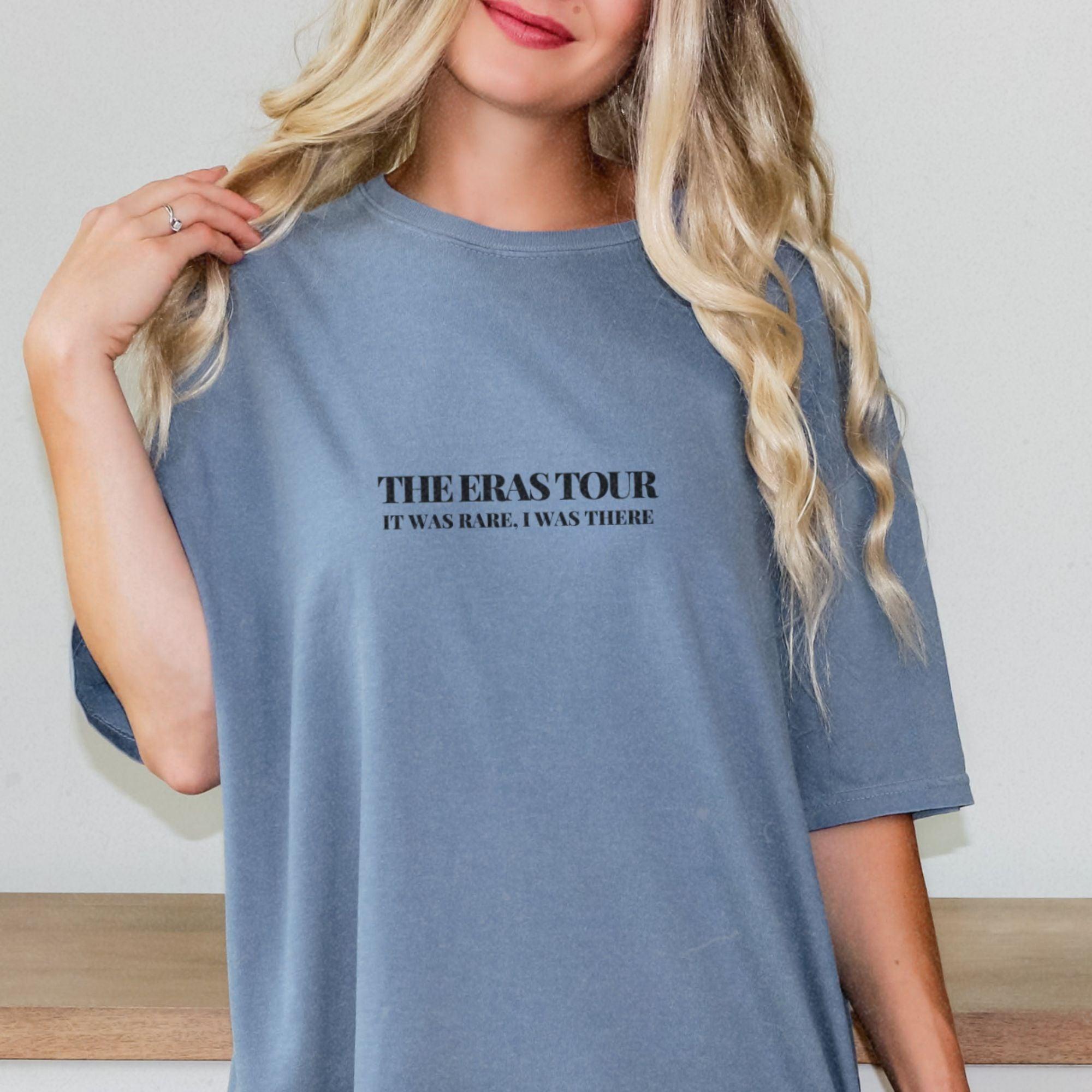 a woman wearing a t - shirt that says, there's a tour it