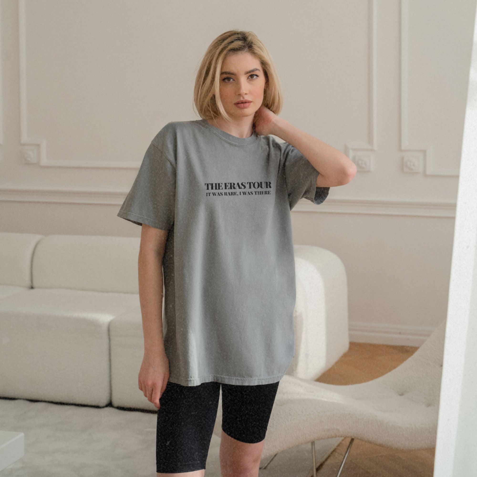 a woman standing in front of a white couch