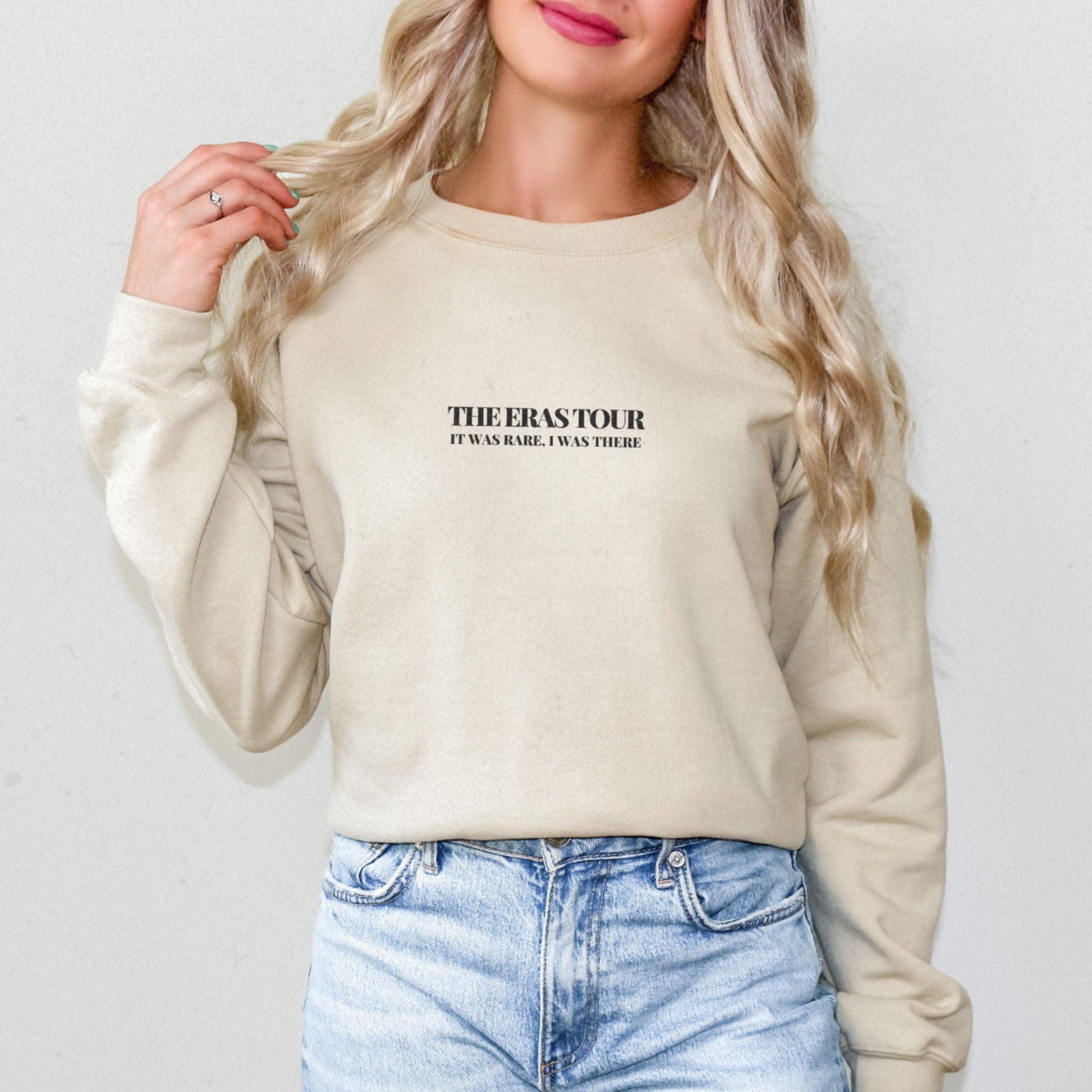 a woman with blonde hair wearing a sweatshirt that says, there's for everyone