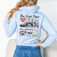 a woman wearing a blue hoodie with pictures on it