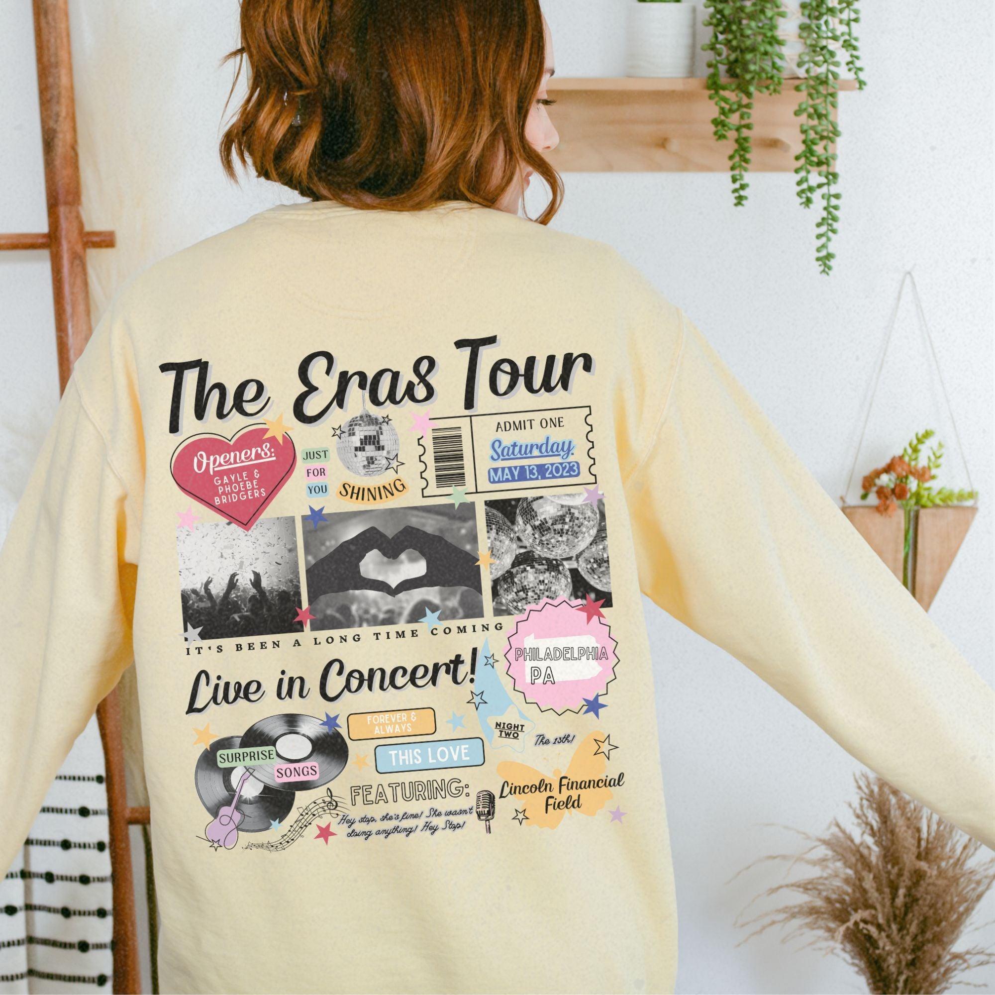 a woman wearing a yellow shirt with pictures on it