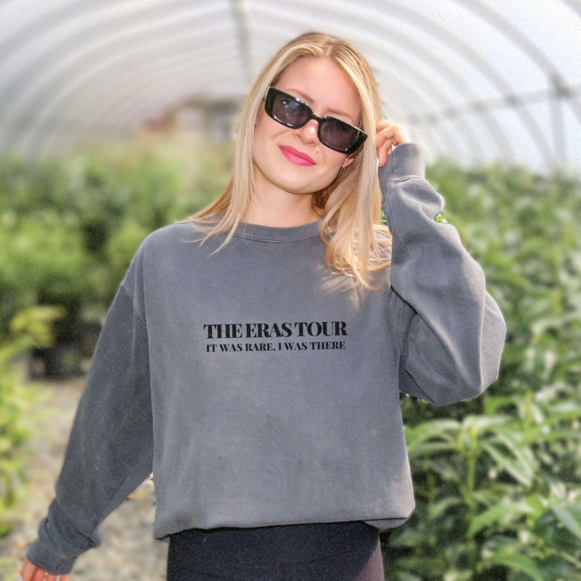 a woman wearing a sweatshirt with the words therastor on it