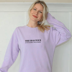 a woman wearing a purple sweatshirt with the words, the rest for it, and