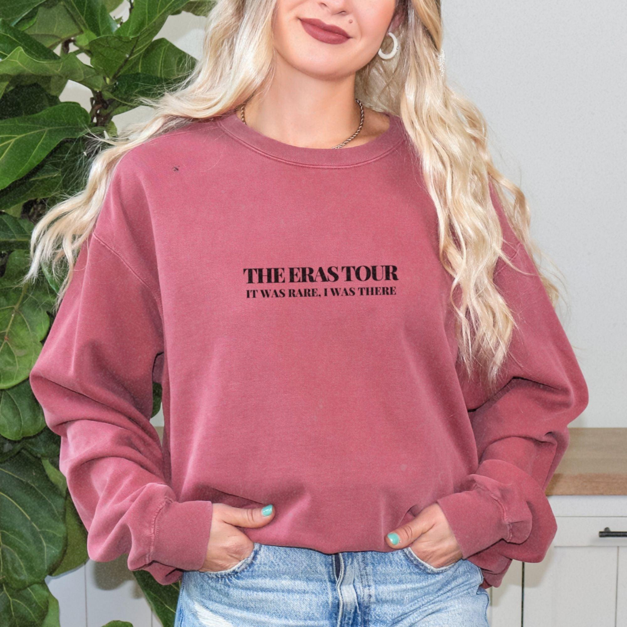 a woman wearing a sweatshirt with the words therastor on it