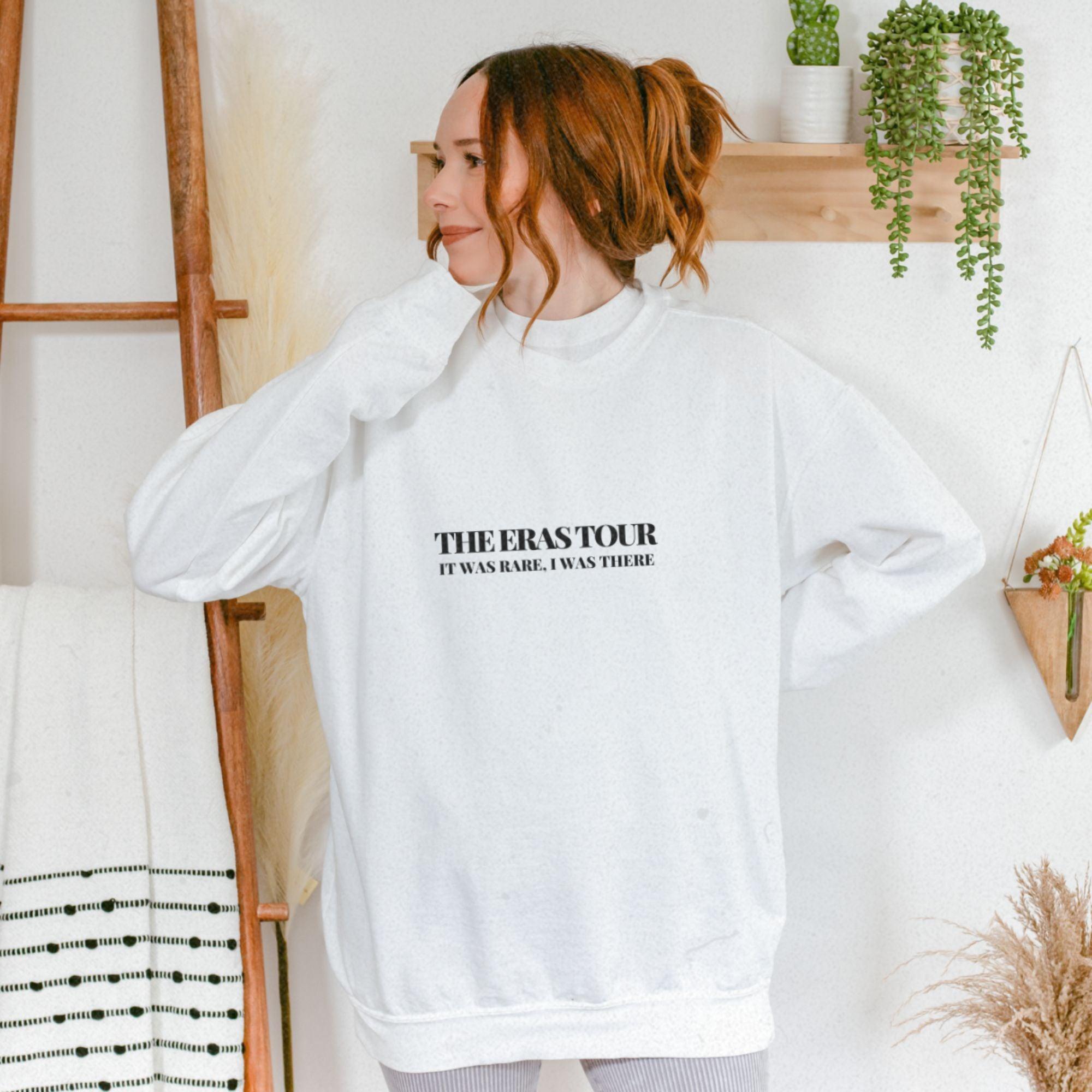 a woman wearing a white sweatshirt with the words the perstoror on it