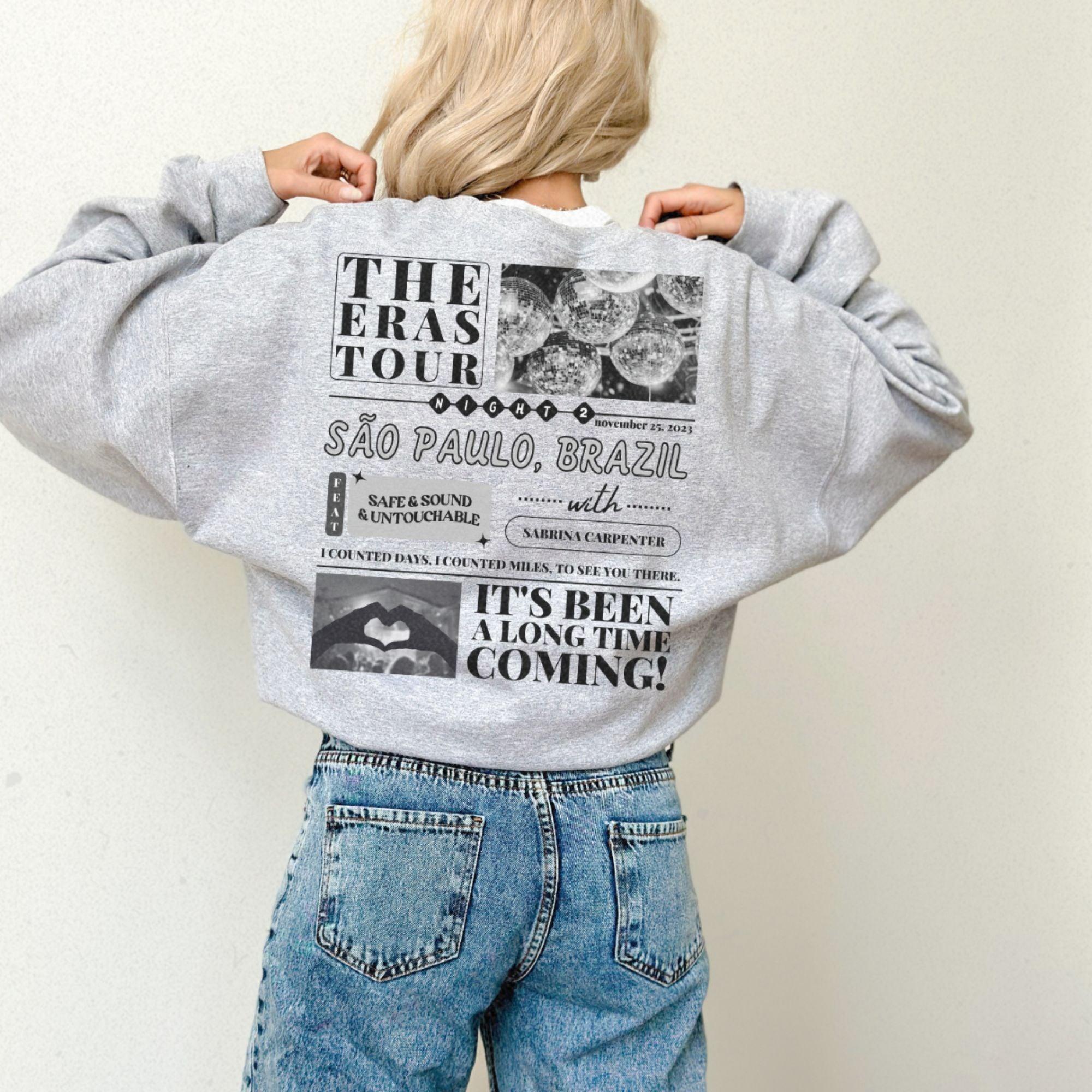 a woman wearing a sweatshirt with a back print