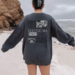 a man standing on a beach with his back to the camera