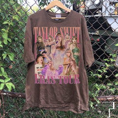 a brown taylor swift t - shirt hanging on a chain link fence