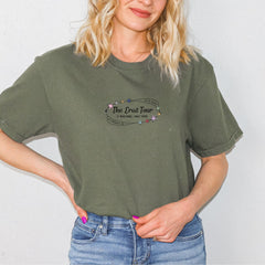 a woman wearing a green shirt and jeans