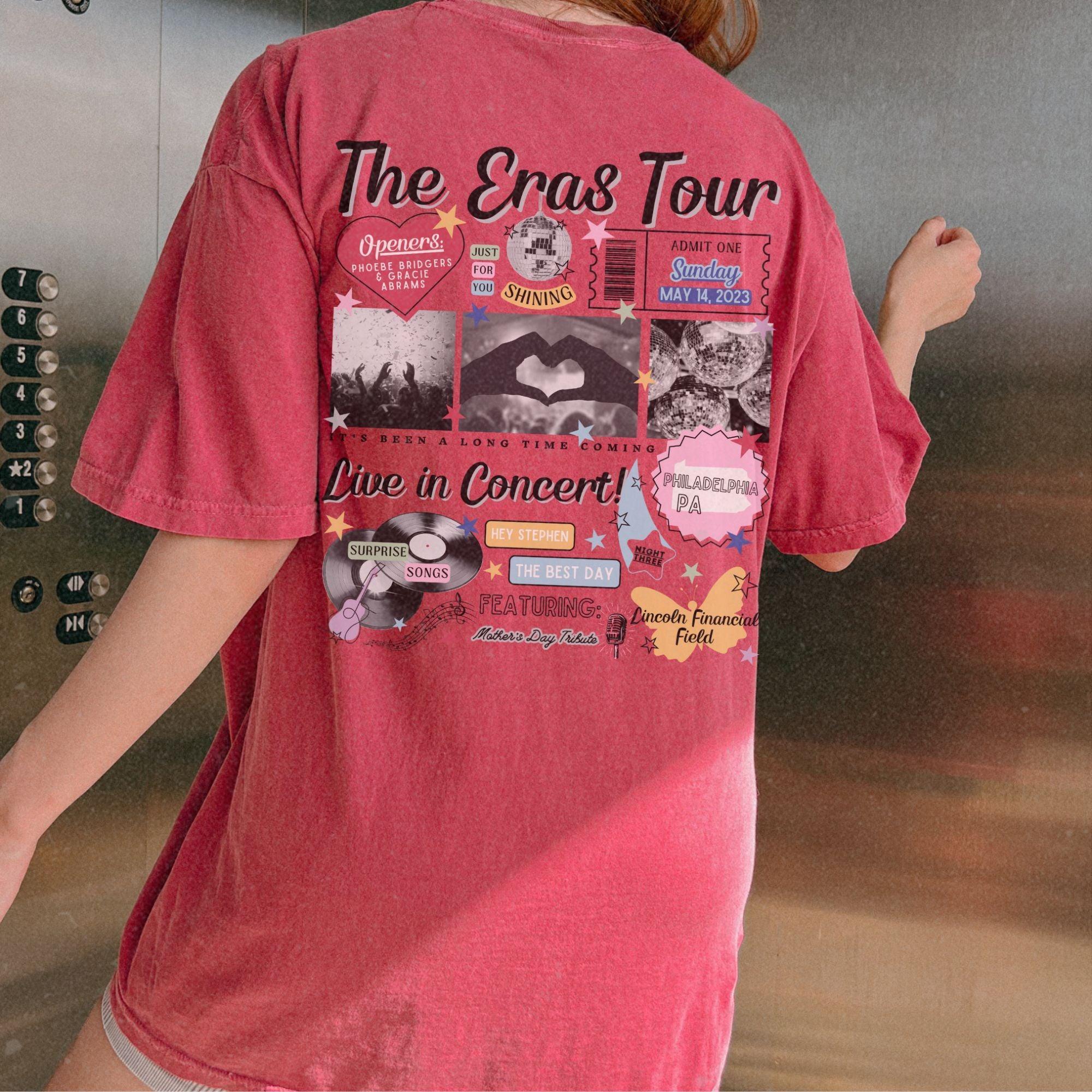 a woman in a pink shirt is standing in front of a metal wall